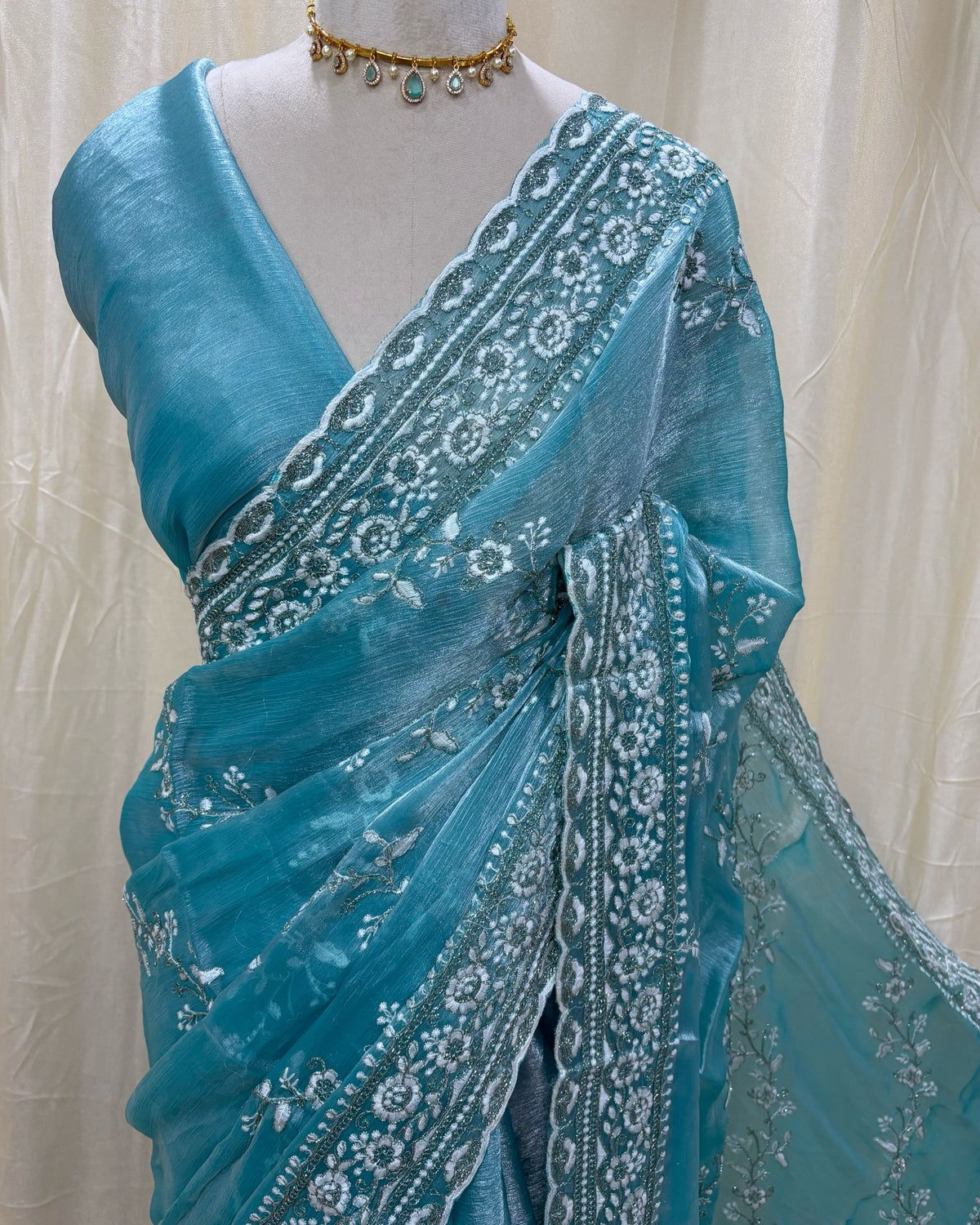 Sky blue soft organza saree with white embroidery all over saree.