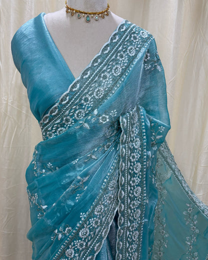 Sky blue soft organza saree with white embroidery all over saree.