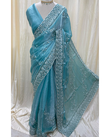Sky blue soft organza saree with white embroidery all over saree.