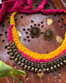 Yellow pink thread braid necklace with antique touch. Comes with earrings
