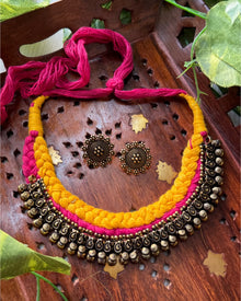 Yellow pink thread braid necklace with antique touch. Comes with earrings