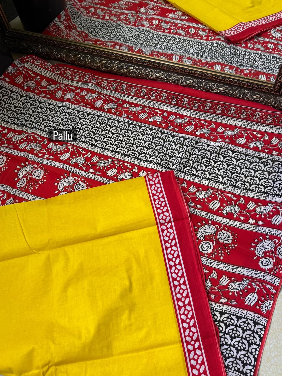 YELLOW COTTON PRINTED SAREE COMES WITH CONTRAST RED BORDER