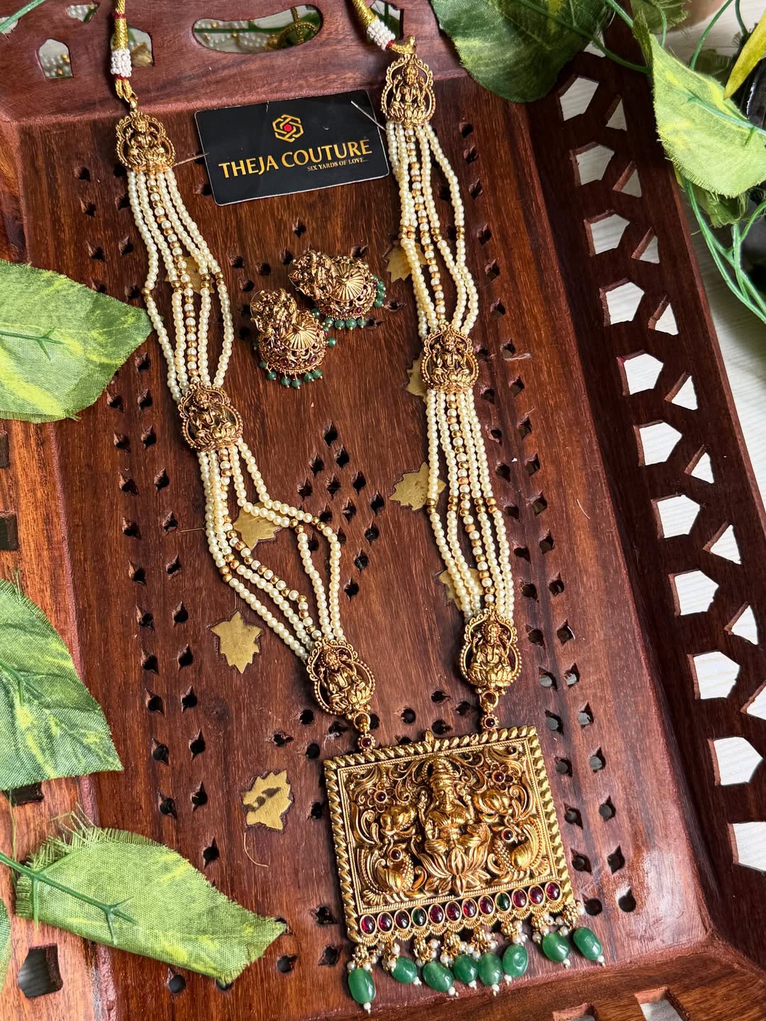 Off white long necklace comes with Lakshmi dollar.