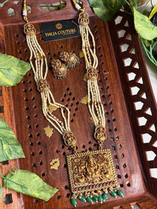 Off white long necklace comes with Lakshmi dollar.