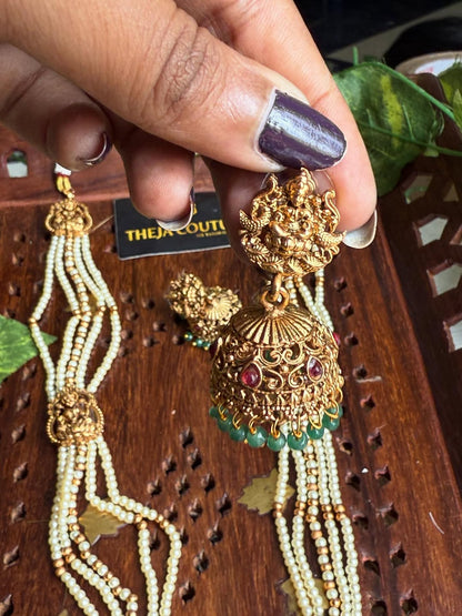 Off white long necklace comes with Lakshmi dollar.