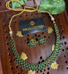 Double line green stone necklace.