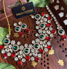 White Kundan short necklace with red and green stone.