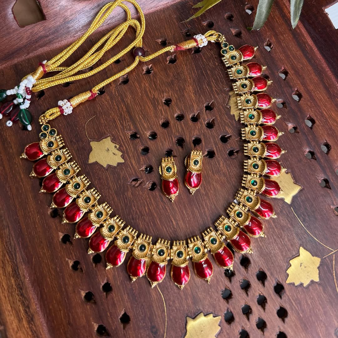 Bold red set in antique gold with a touch of green Necklace.