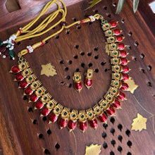 Bold red set in antique gold with a touch of green Necklace.