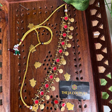Floral coin choker paired with earrings.