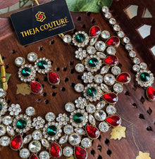 White Kundan short necklace with red and green stone.