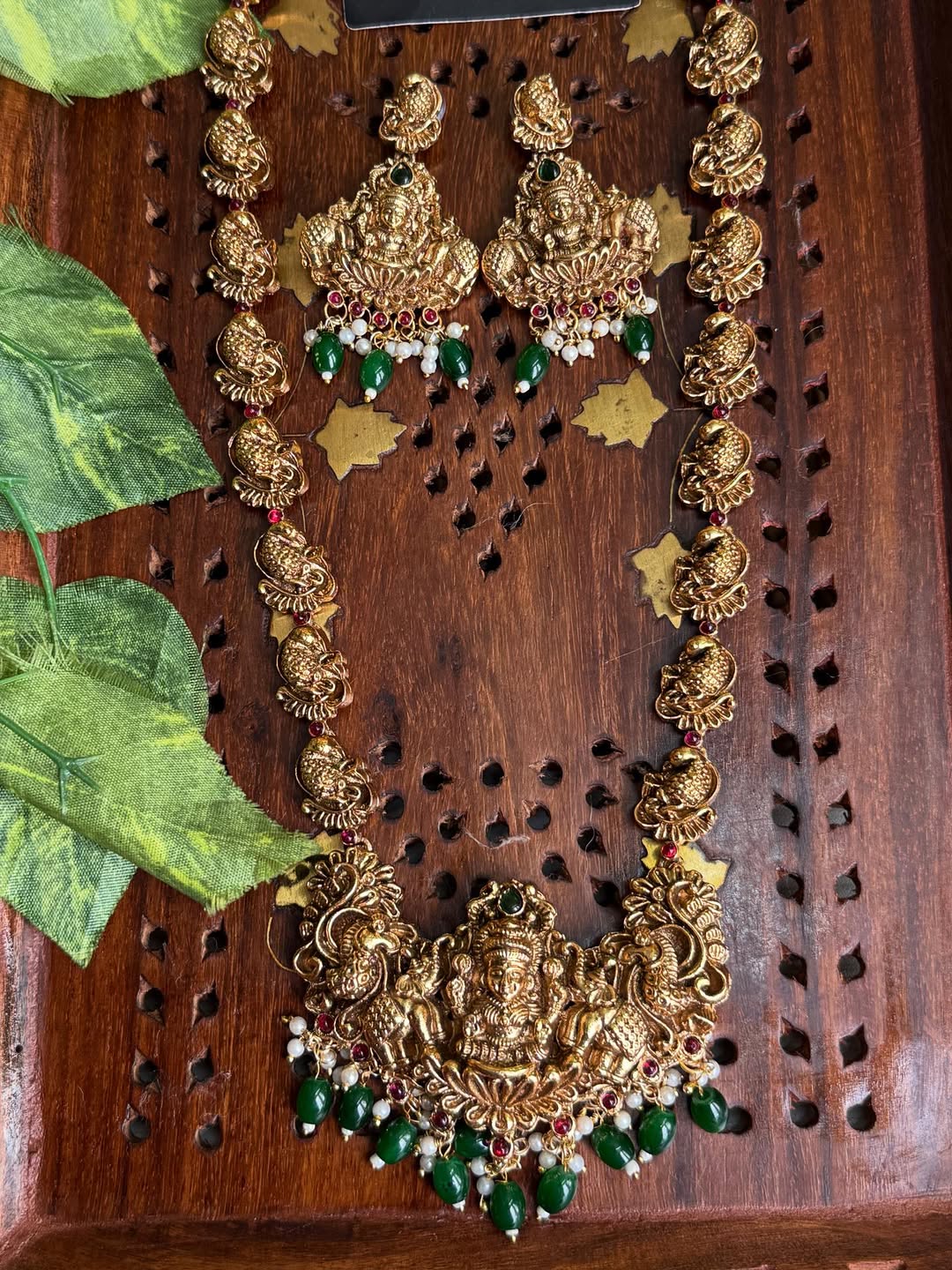 Long antique Lakshmi haram paired with earrings.