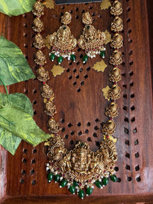 Long antique Lakshmi haram paired with earrings.
