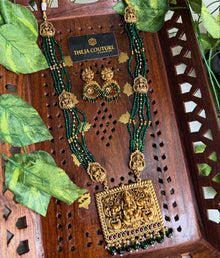Bottle green long necklace with square Lakshmi dollar.