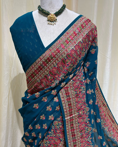 Teal blue chiffon georgette saree.