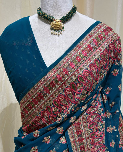 Teal blue chiffon georgette saree.