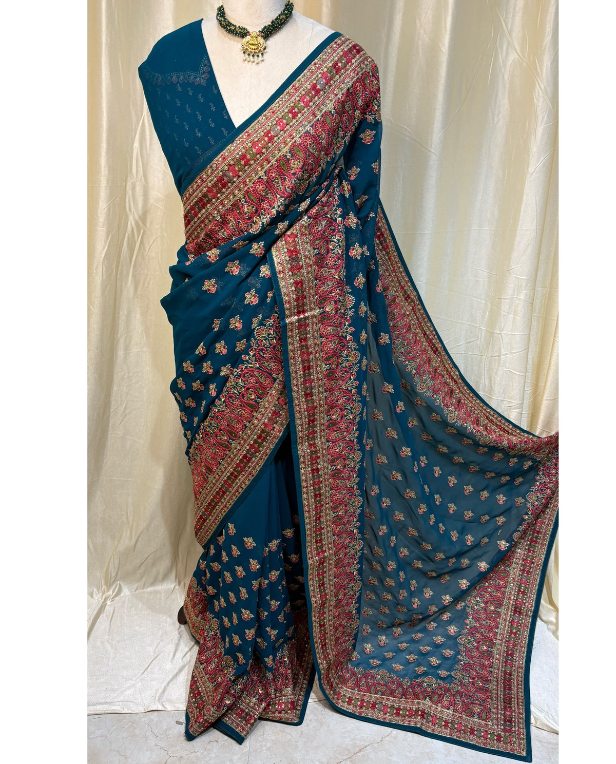 Teal blue chiffon georgette saree.