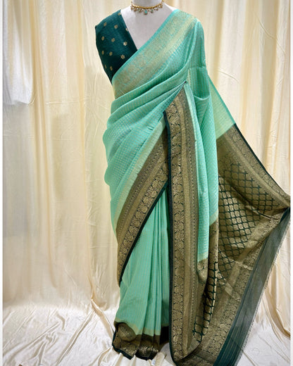 Turquoise blue chiffon saree with bottle green border