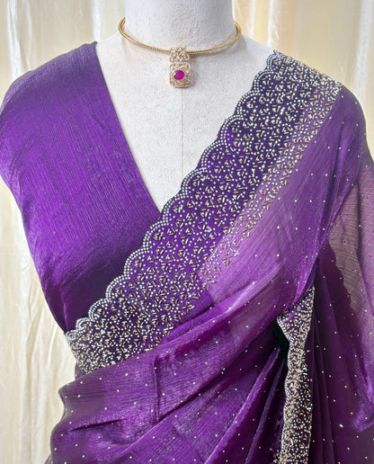 Violet georgette saree with white stones.