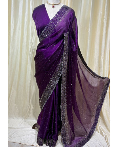 Violet georgette saree with white stones.