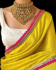 YELLOW TISSUE SAREE WITH PINK LACE