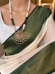 WHITE ART SILK SAREE WITH CONTRAST GREEN BORDER