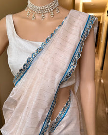 WHITE JUTE SILK SAREE WITH SKY BLUE LACE
