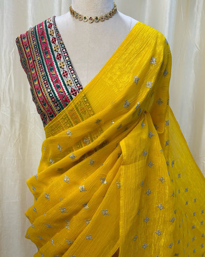 Yellow sequence georgette saree comes with Multi color embroidery blouse .