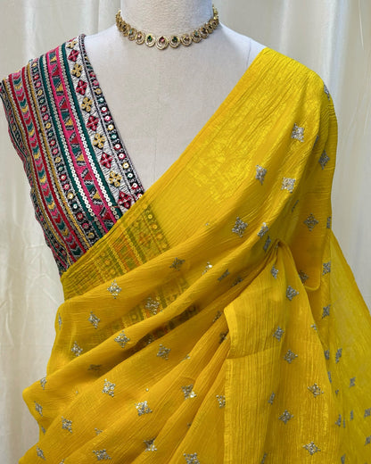 Yellow sequence georgette saree comes with Multi color embroidery blouse .