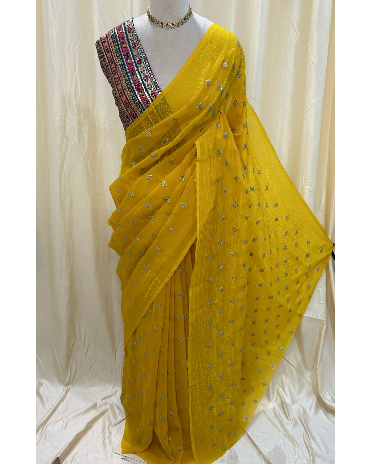 Yellow sequence georgette saree comes with Multi color embroidery blouse .