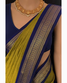 PEAR GREEN COTTON SILK SAREE WITH BLUE BORDER.
