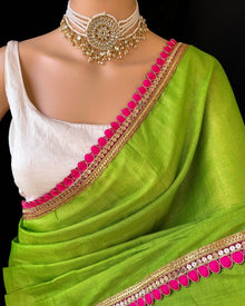 GREEN TISSUE SAREE WITH PINK LACE