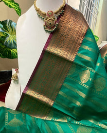 GREEN ART SILK SAREE WITH PINK BORDER