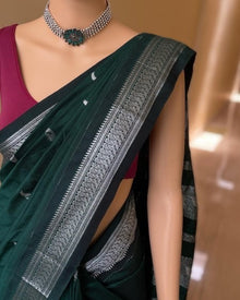 BOTTLE GREEN SILK COTTON SAREE WITH SILVER BORDER.