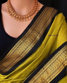 PEAR GREEN COTTON SILK SAREE WITH BLACK BORDER.