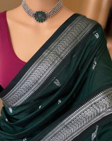 BOTTLE GREEN SILK COTTON SAREE WITH SILVER BORDER.