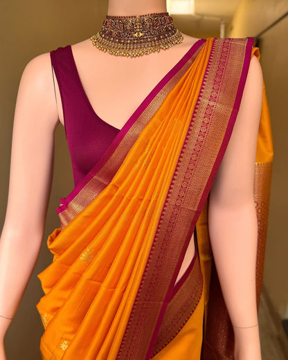 Mango yellow art silk saree with magenta pink border.