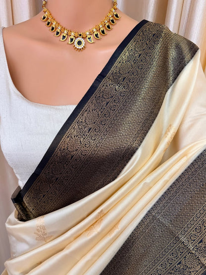 OFF WHITE ART SILK SAREE COMES WITH CONTRAST ZARI WEAVE BORDER