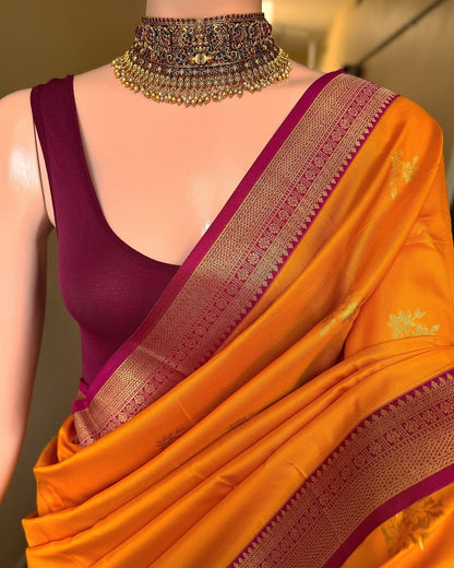 Mango yellow art silk saree with magenta pink border.