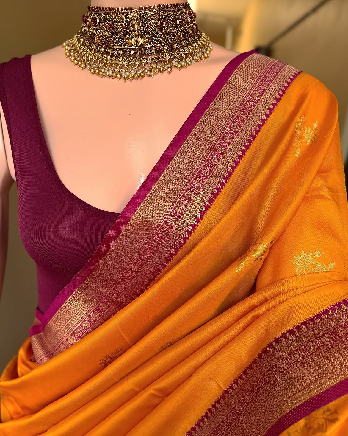 Mango yellow art silk saree with magenta pink border.